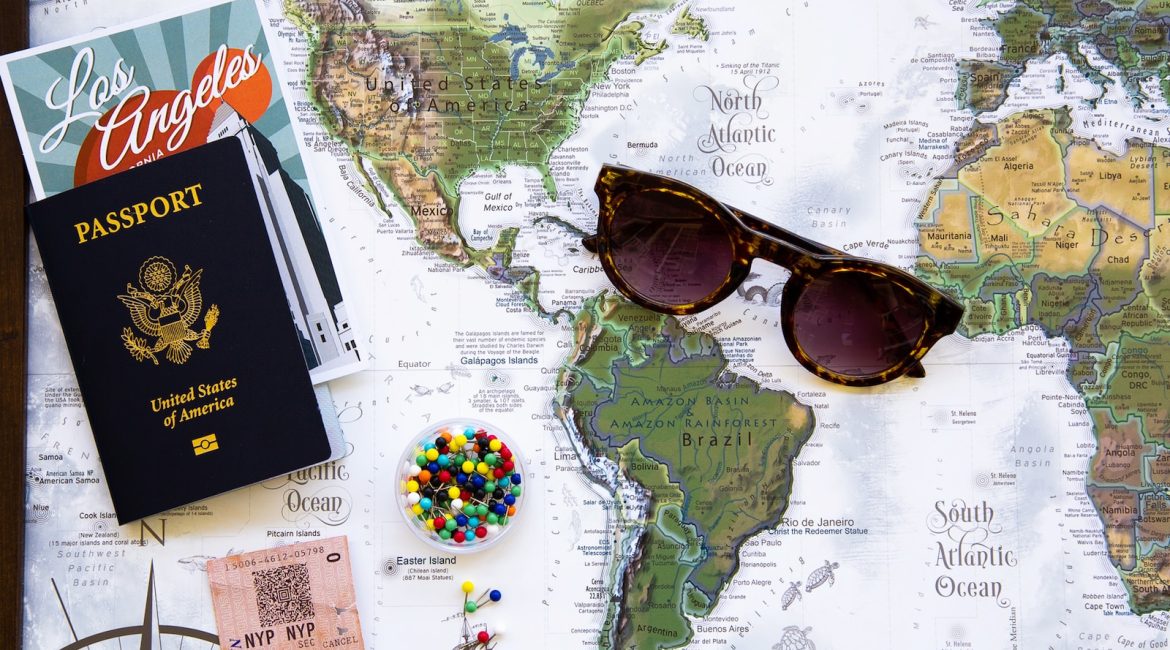 brown framed sunglasses on map