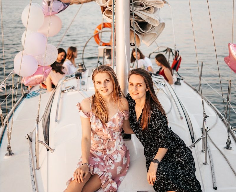 Woman in Black and White Dress on Boat